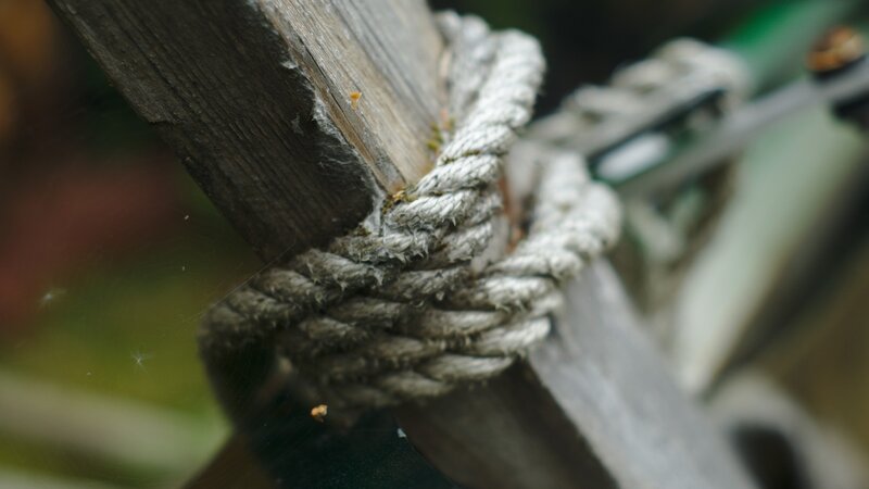 Rope Tied to Wooden Post — Brown