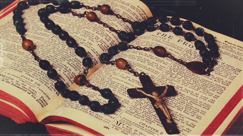 Rosary on Open Book