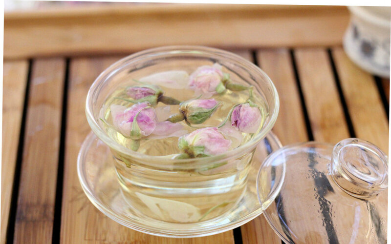 Rose Buds in Glass Cup