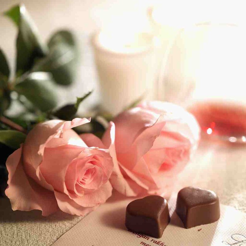 roses and chocolates on table
