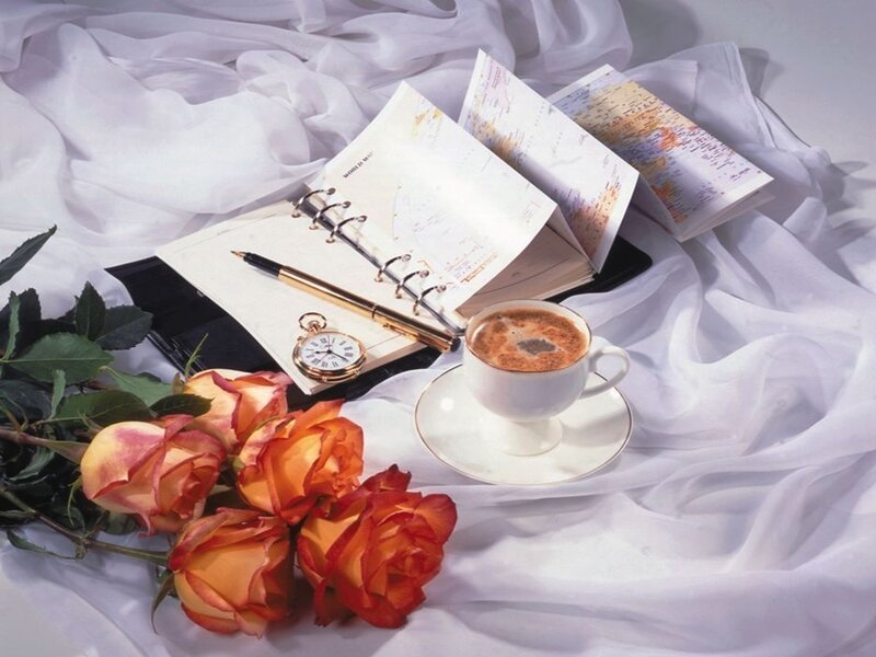 roses and coffee on white cloth