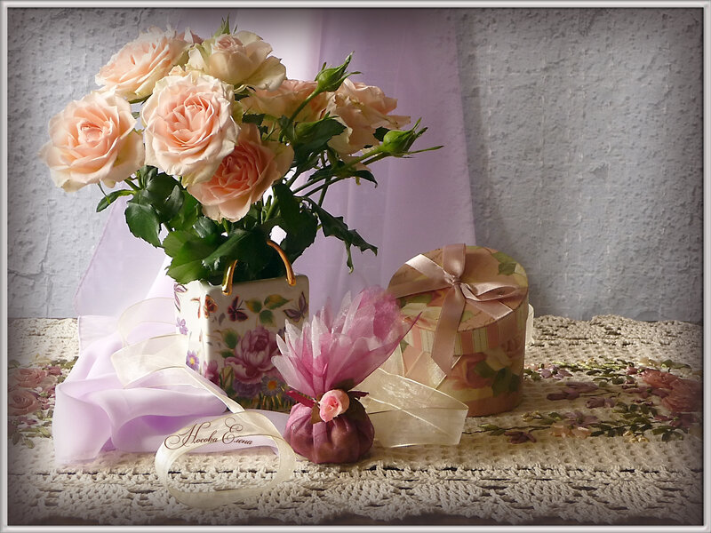 Roses and gifts on lace