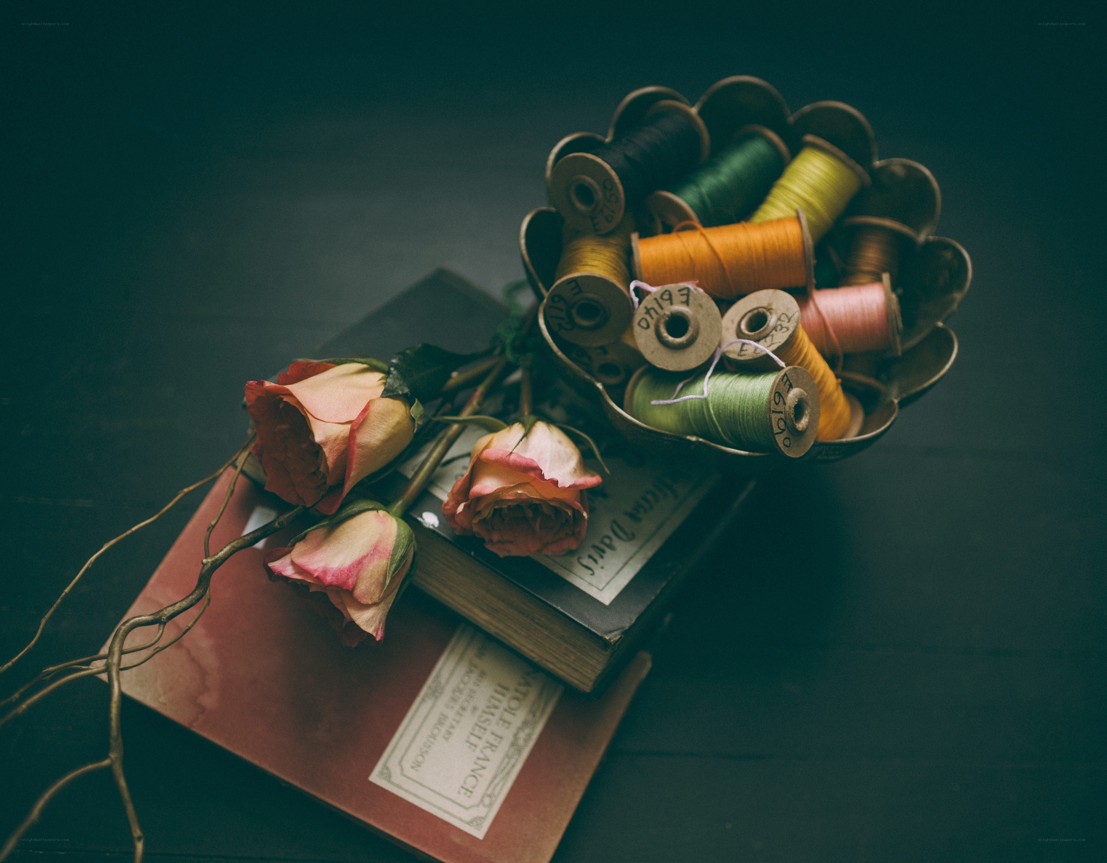 Roses and spools of thread