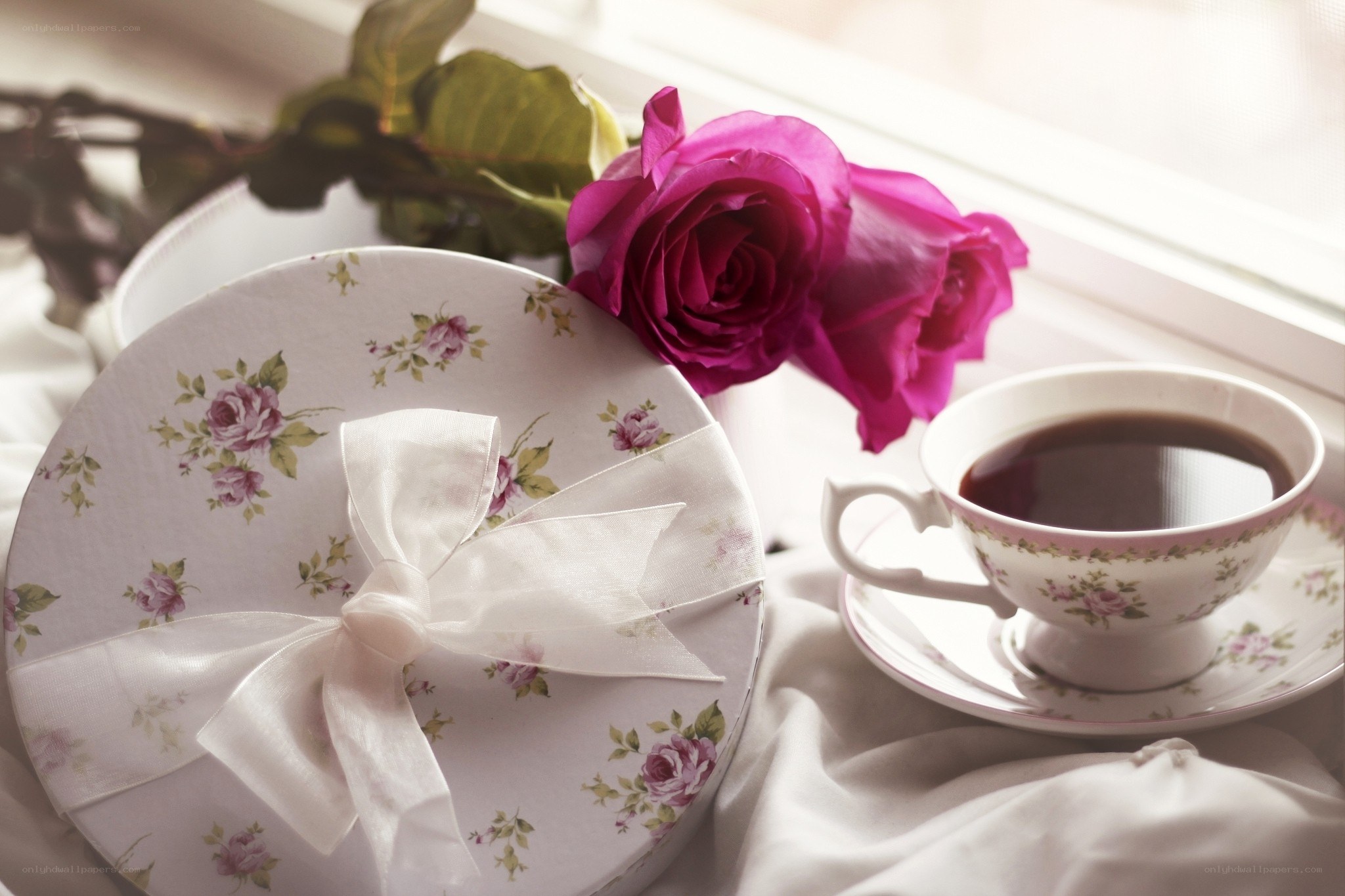 roses and tea on a windowsill