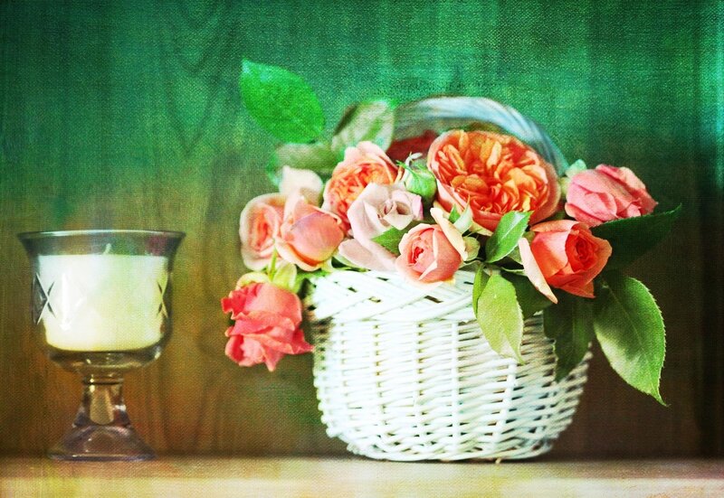 Roses in a basket with candle