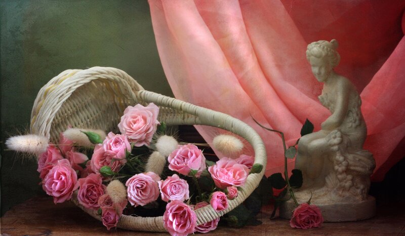 Roses in a basket with statue