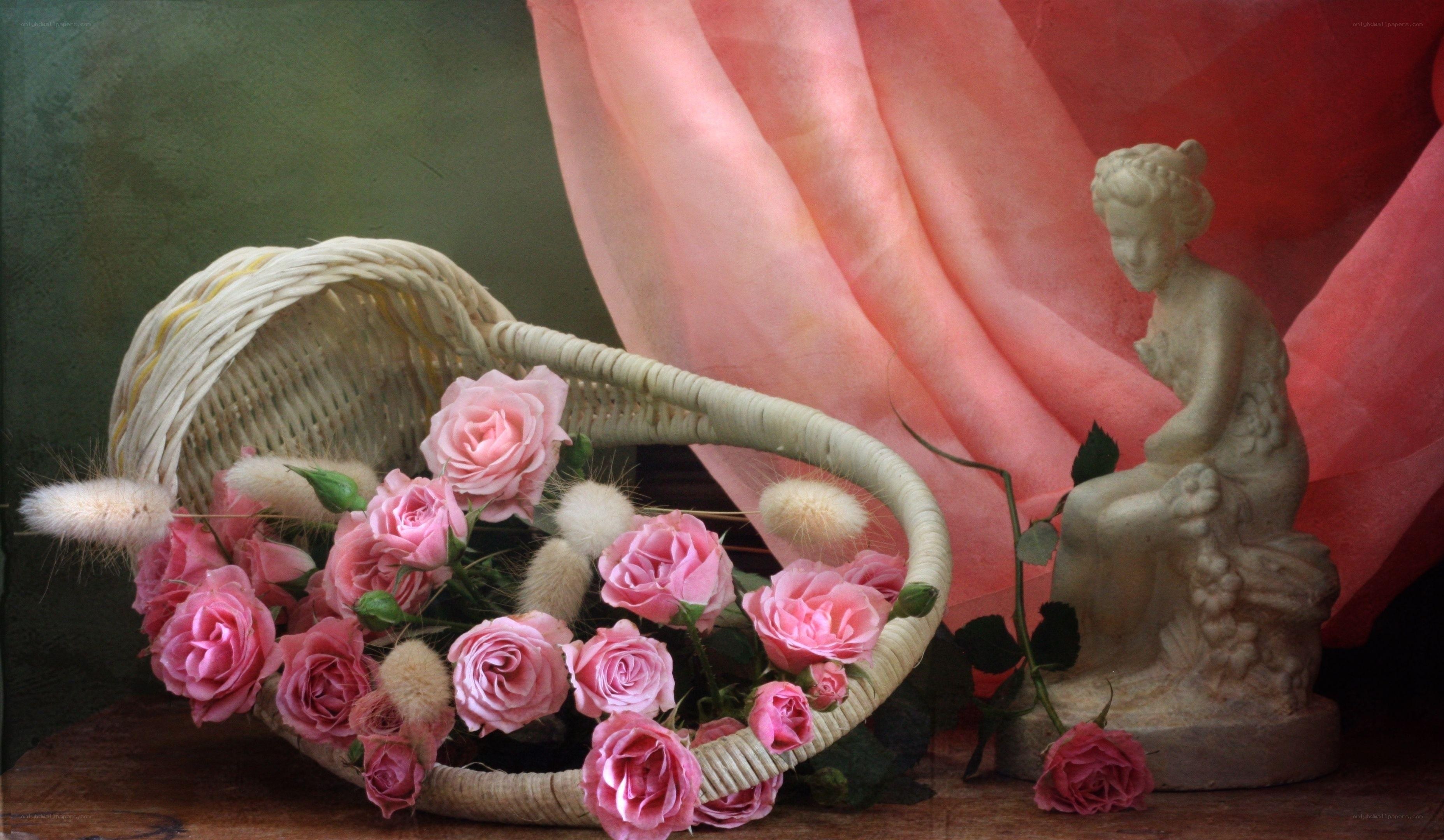 Roses in a basket with statue