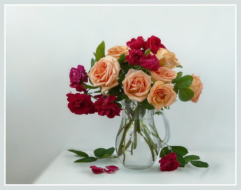 roses in a glass pitcher