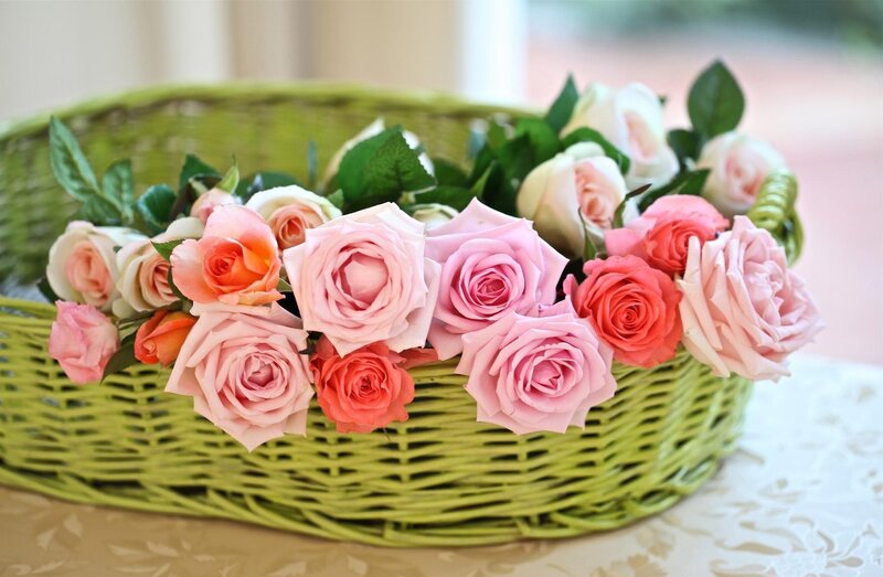 roses in a green basket