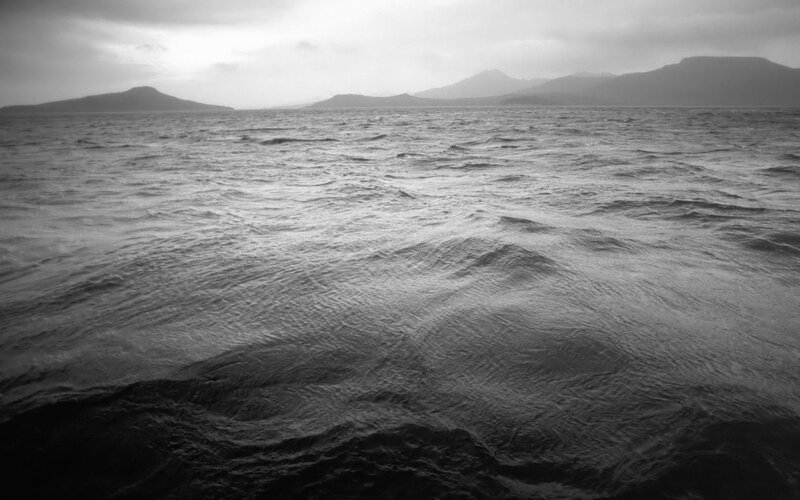 Rough Sea with Distant Mountains