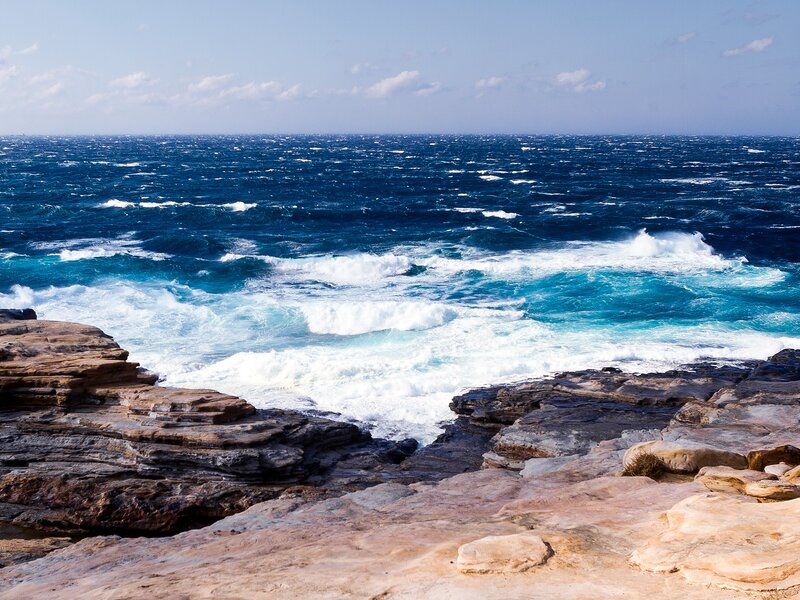 Rough seas at rocky coastline