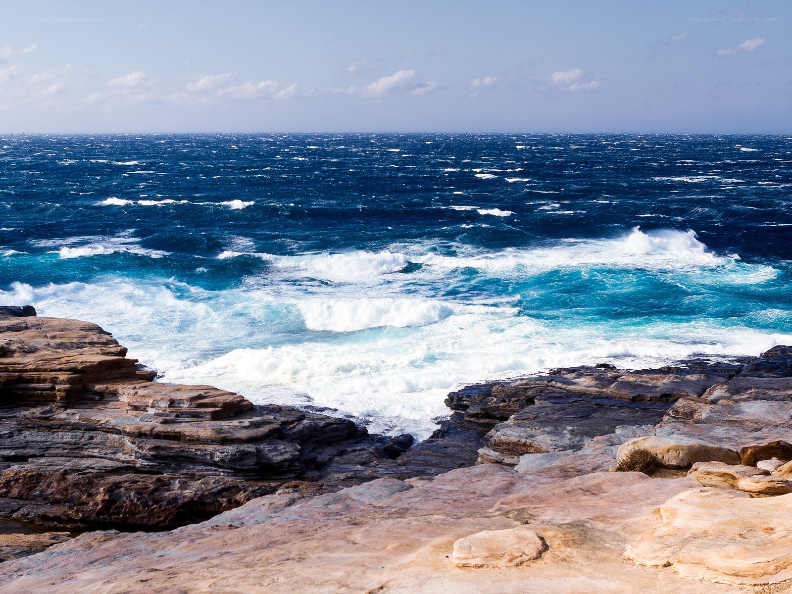 Rough seas at rocky coastline