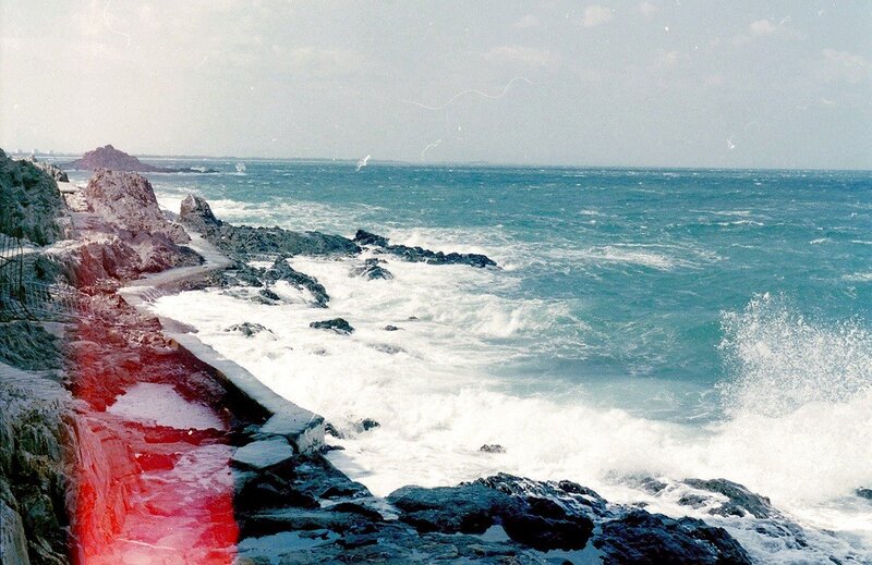 Rough waves on rocky coast