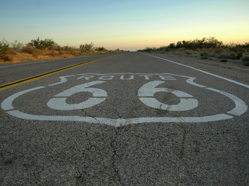 Route 66 road sign at sunset