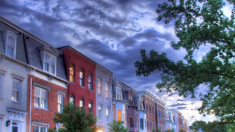 Row houses under dramatic sky