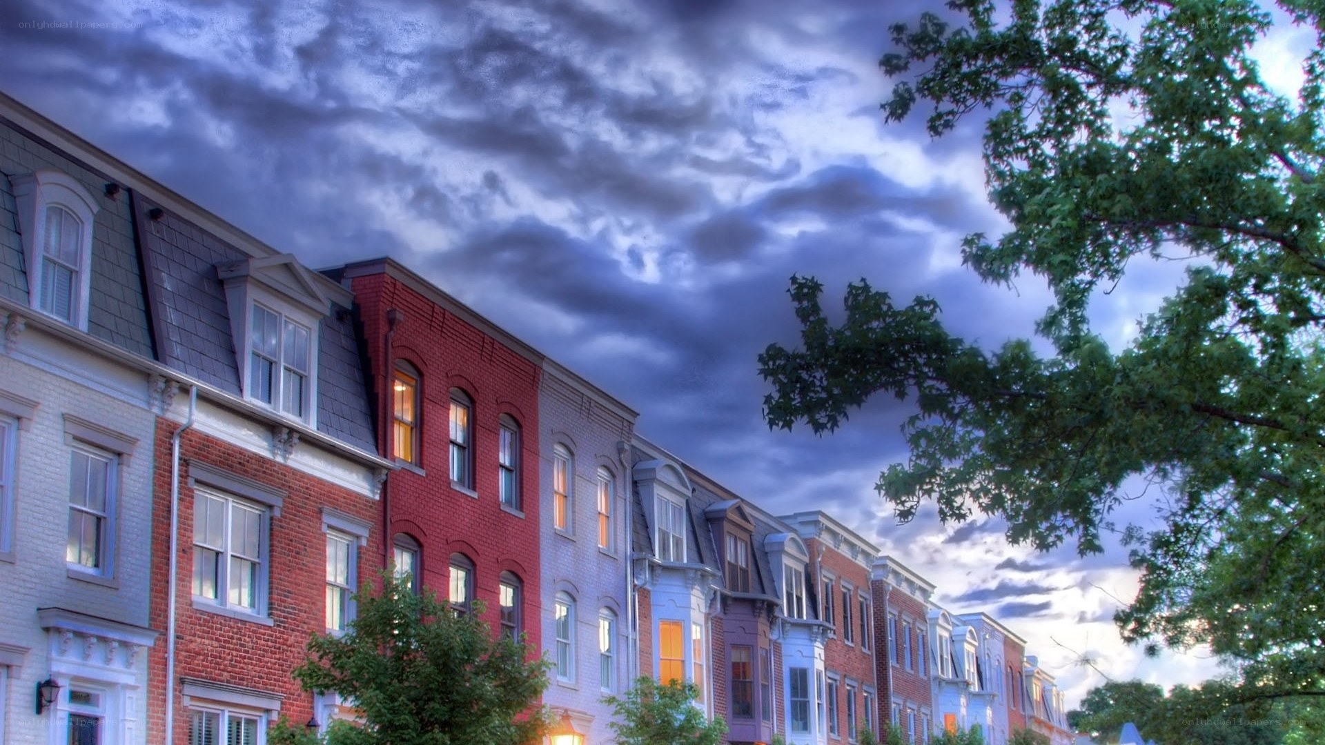 Row houses under dramatic sky