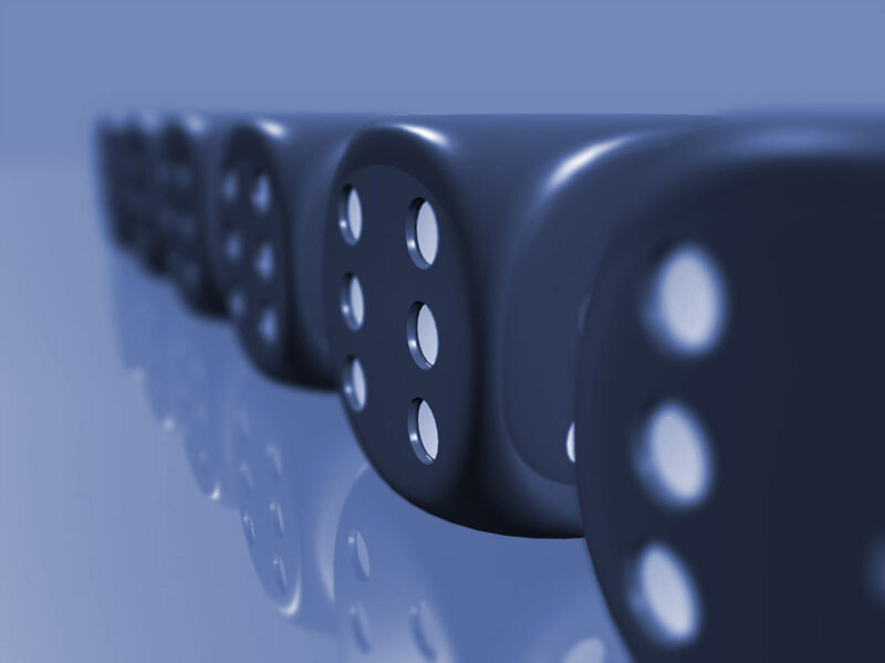 row of black dice on blue surface