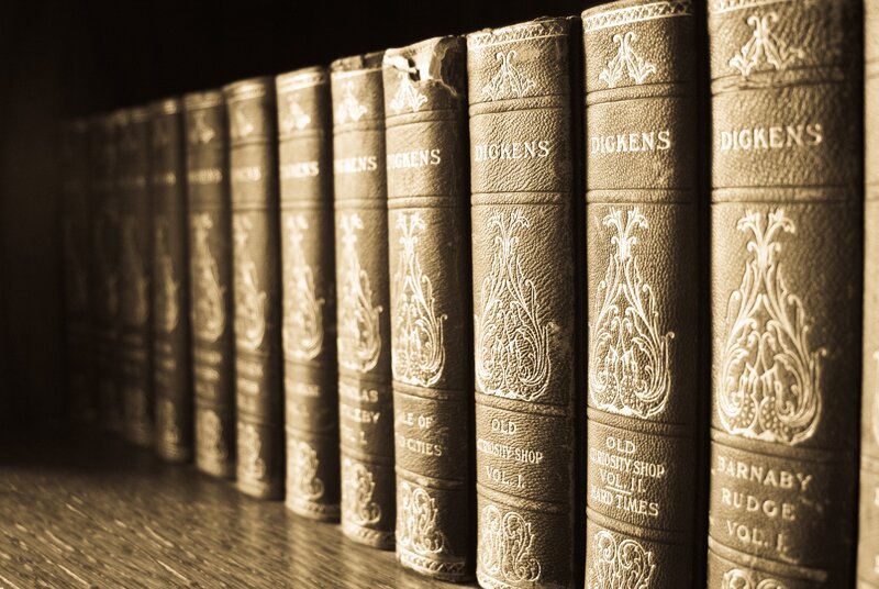 Row of Dickens books on shelf
