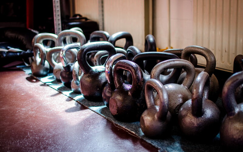 Row of kettlebells in gym