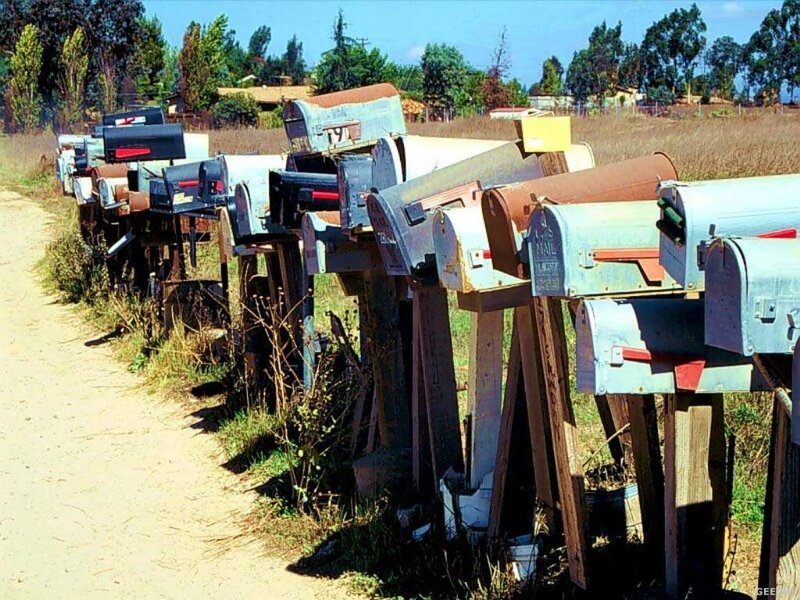Row of mailboxes on a dirt road