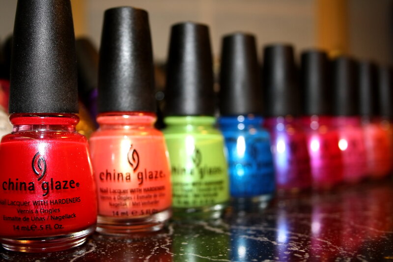 Row of Nail Polish Bottles — Red