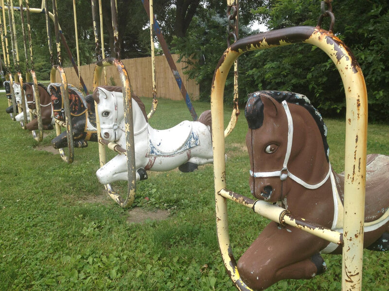 Row of Old Carousel Horses