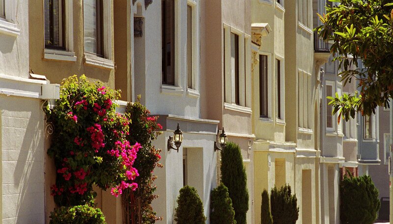 row of townhouses with flowers