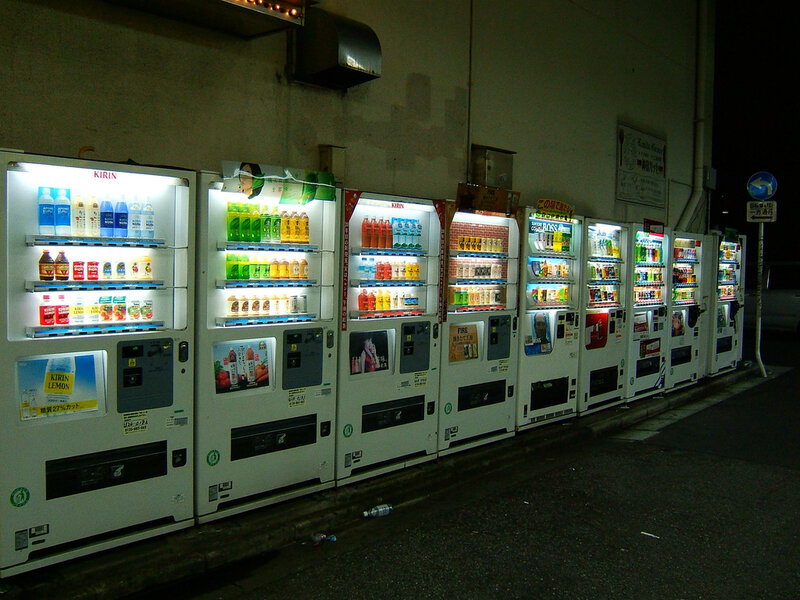 row of vending machines at night