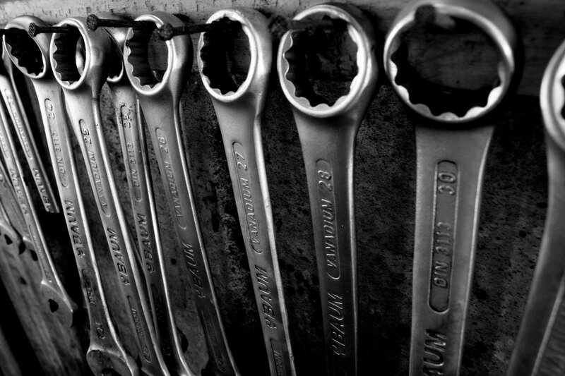 row of wrenches on a wall