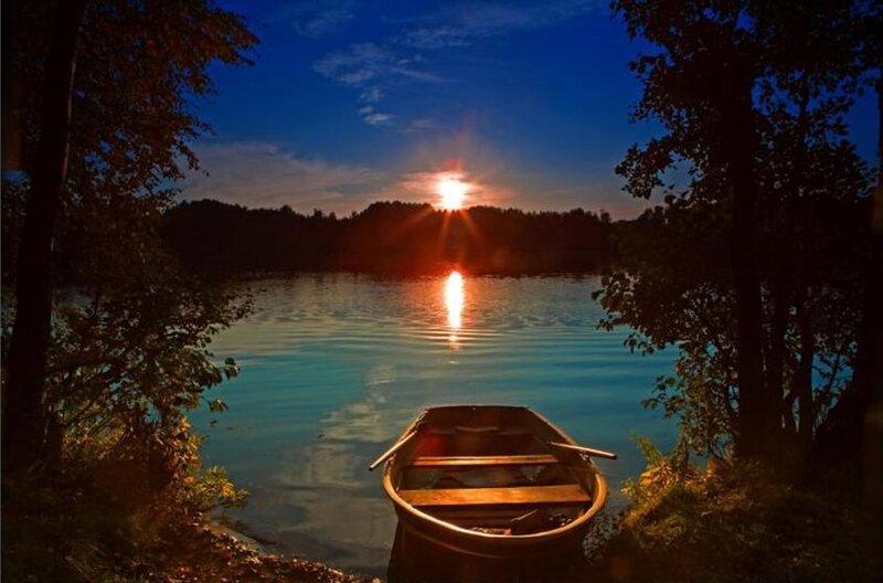 Rowboat on Lake at Sunset