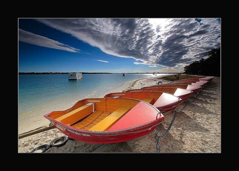 Rowboats on a sunny beach