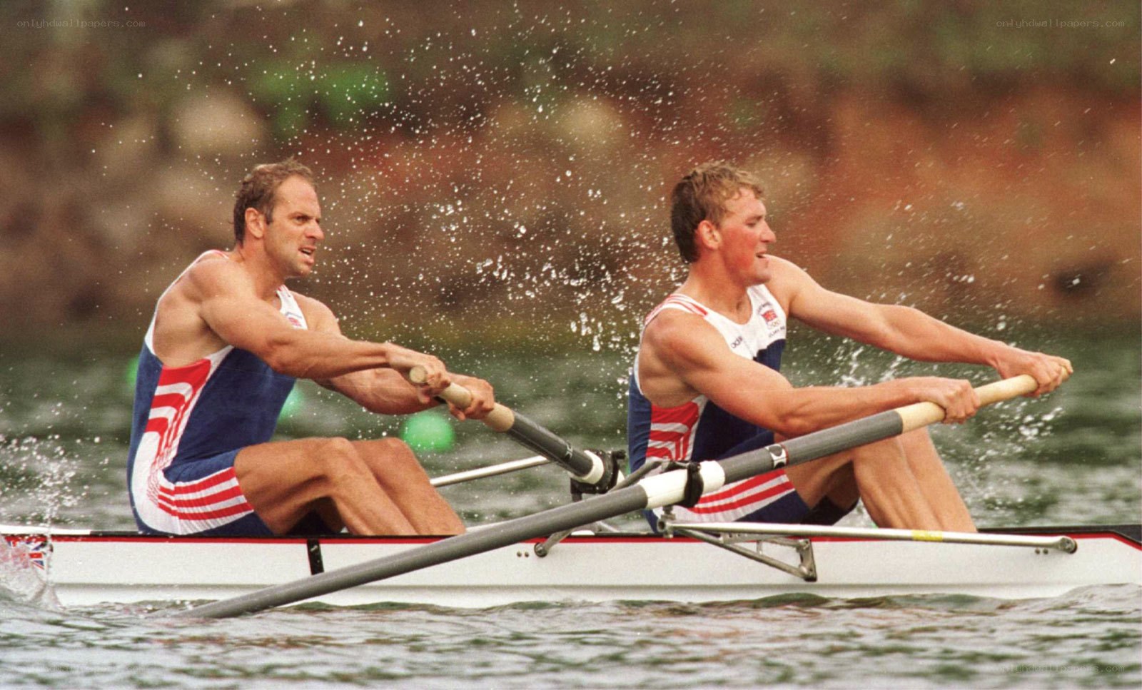 Rowers in action on water
