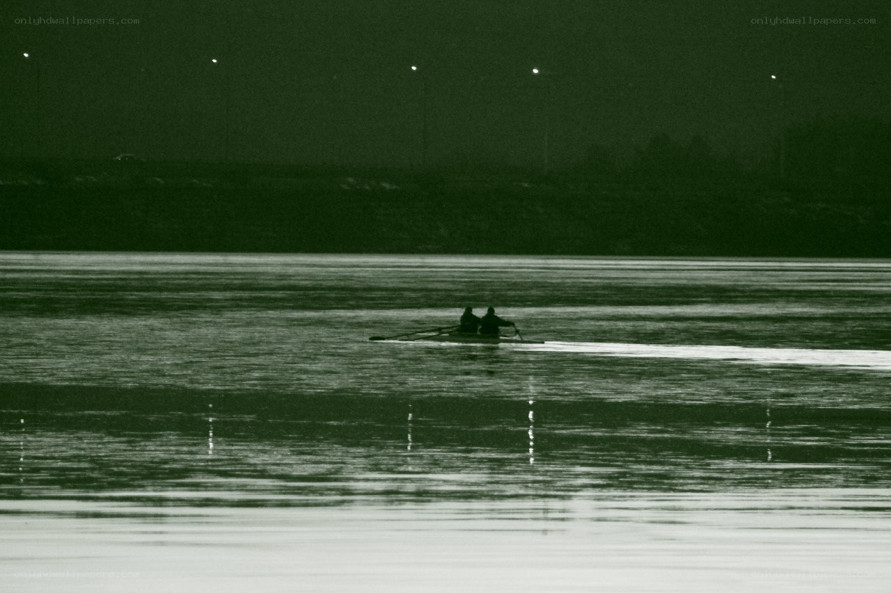 Rowers on a calm river