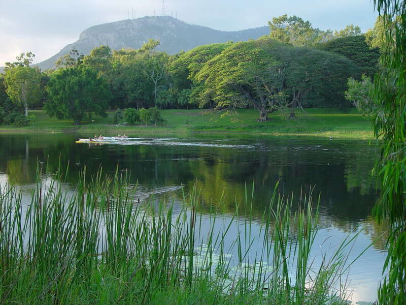 Rowers on a lake with mountain view