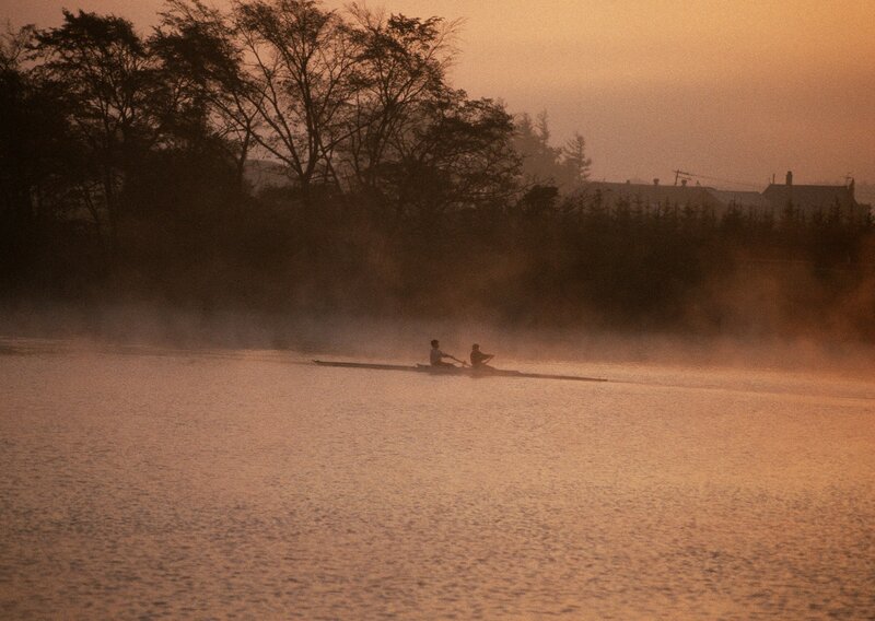 Rowers on a misty river