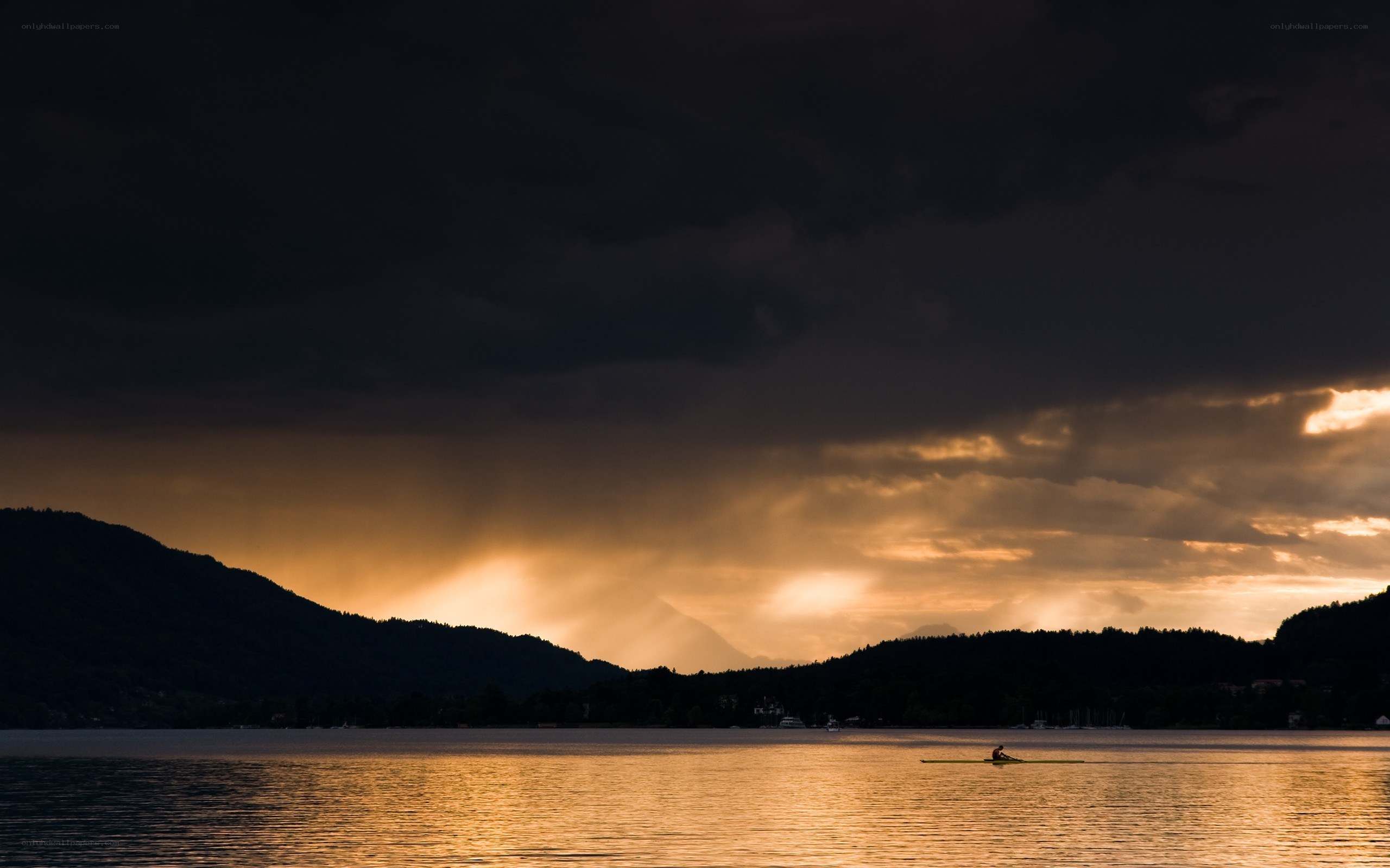 Rowing at sunset on a lake
