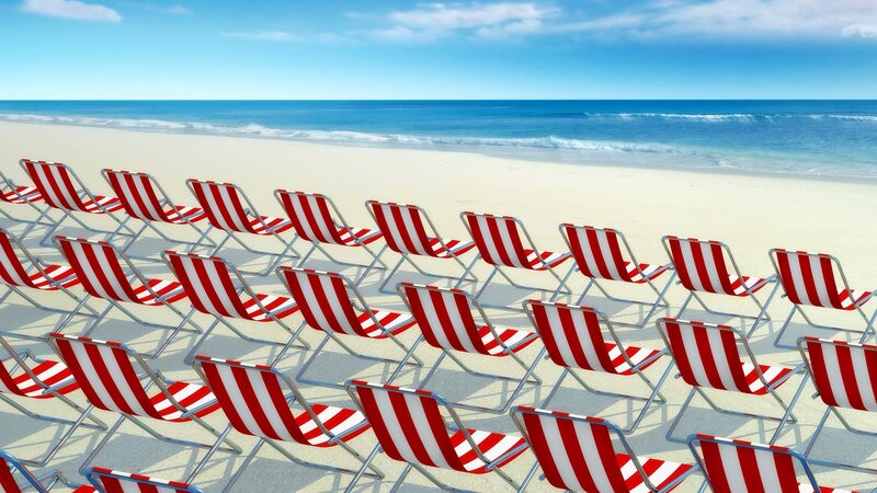 Rows of beach chairs on sand