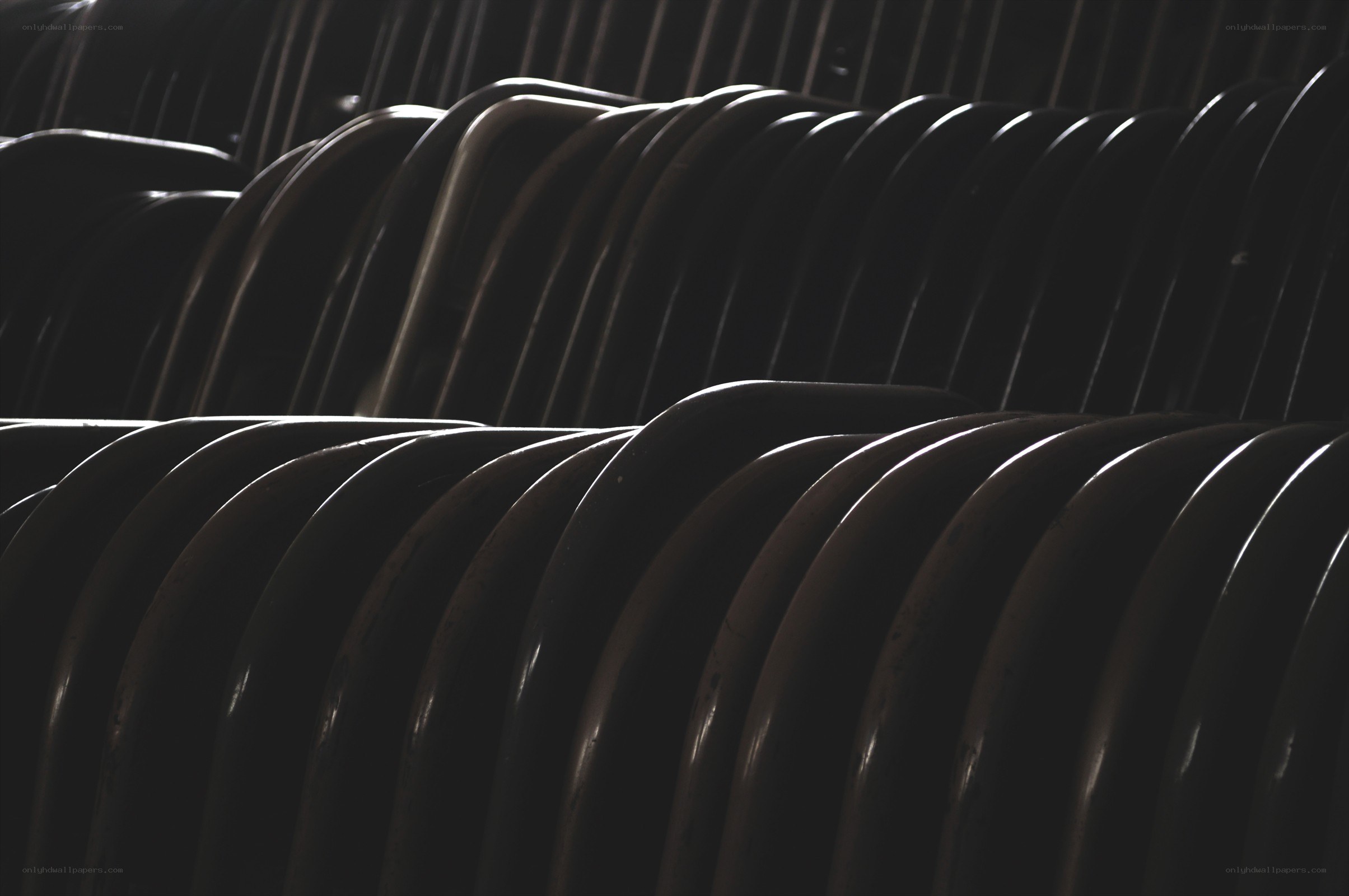 Rows of empty chairs in shadow