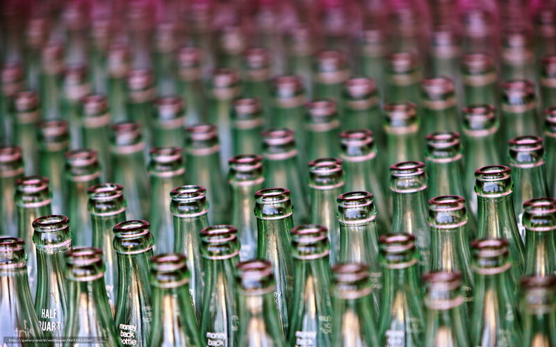 Rows of green glass bottles
