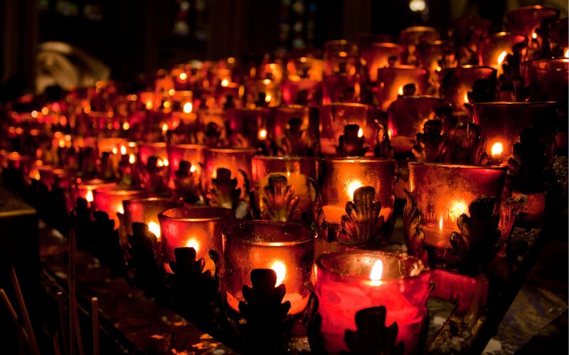 Rows of Lit Candles — Red
