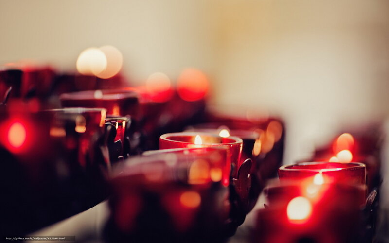 Rows of lit candles