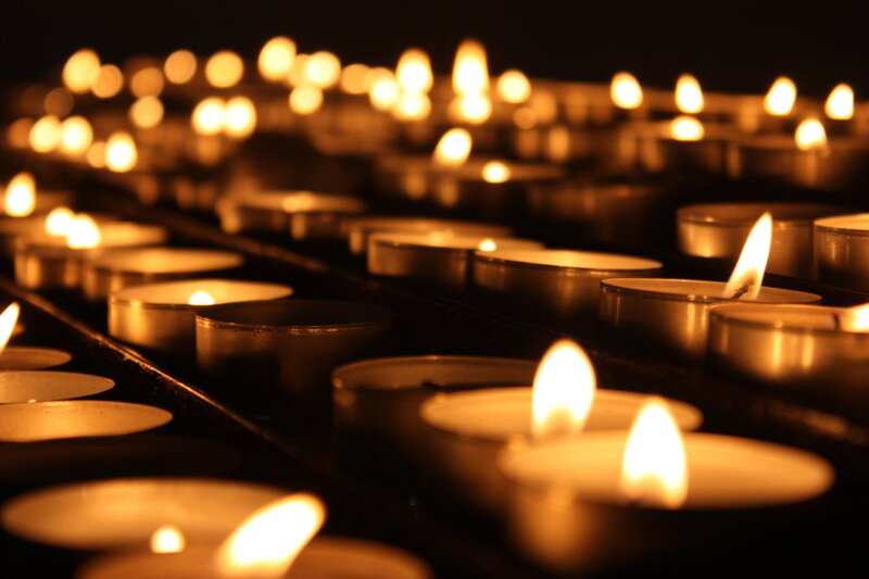 Rows of Lit Candles — Yellow