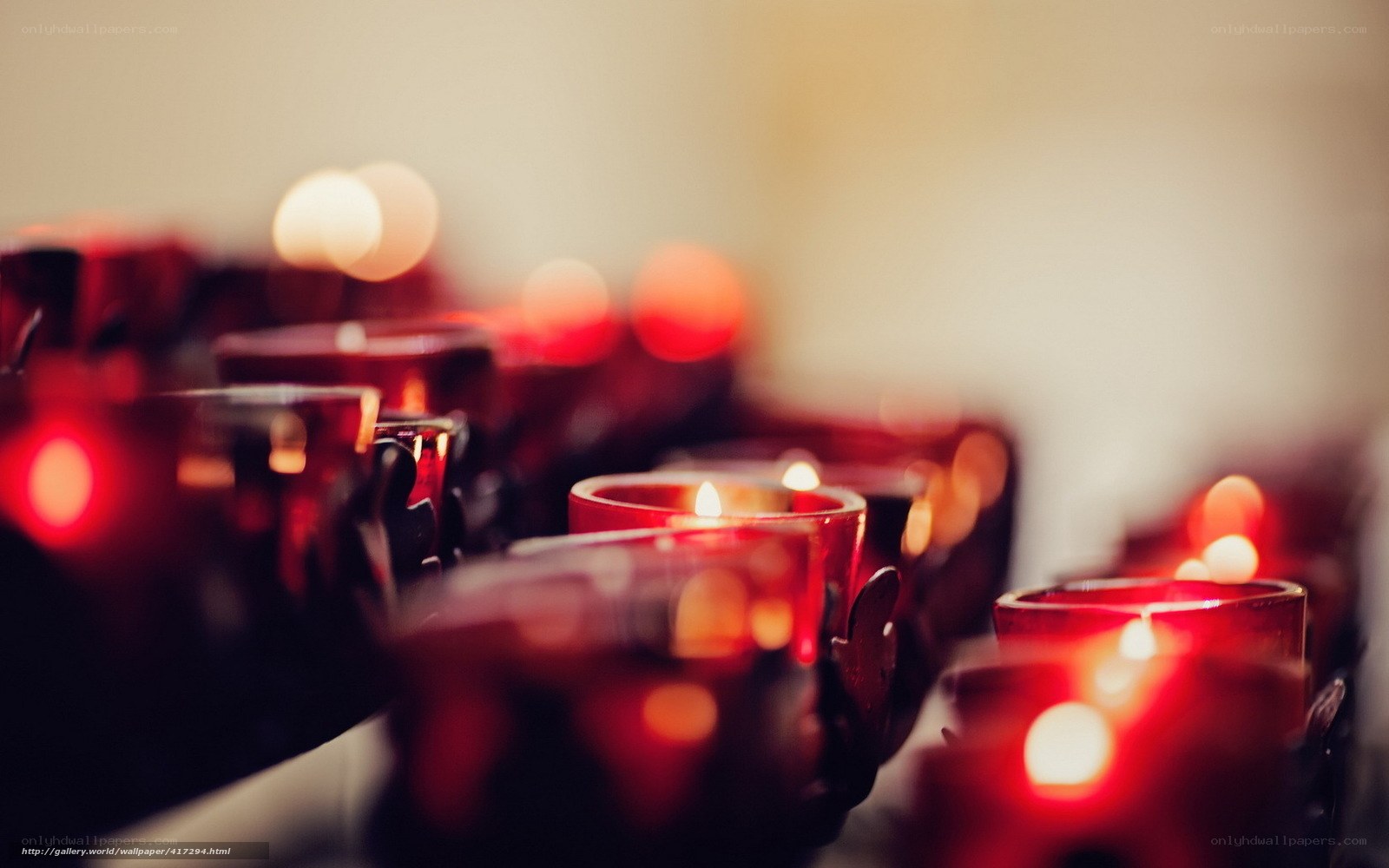 Rows of lit candles