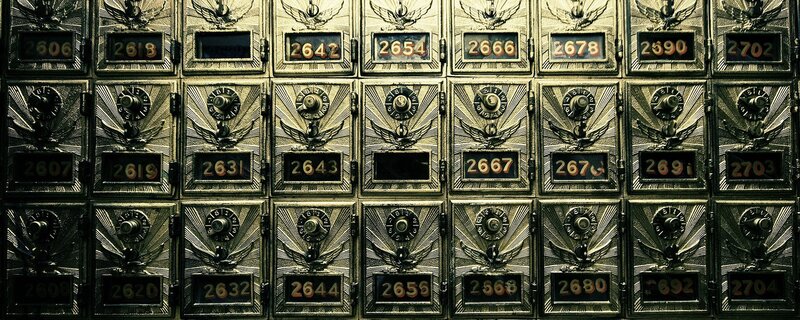 rows of numbered safe deposit boxes