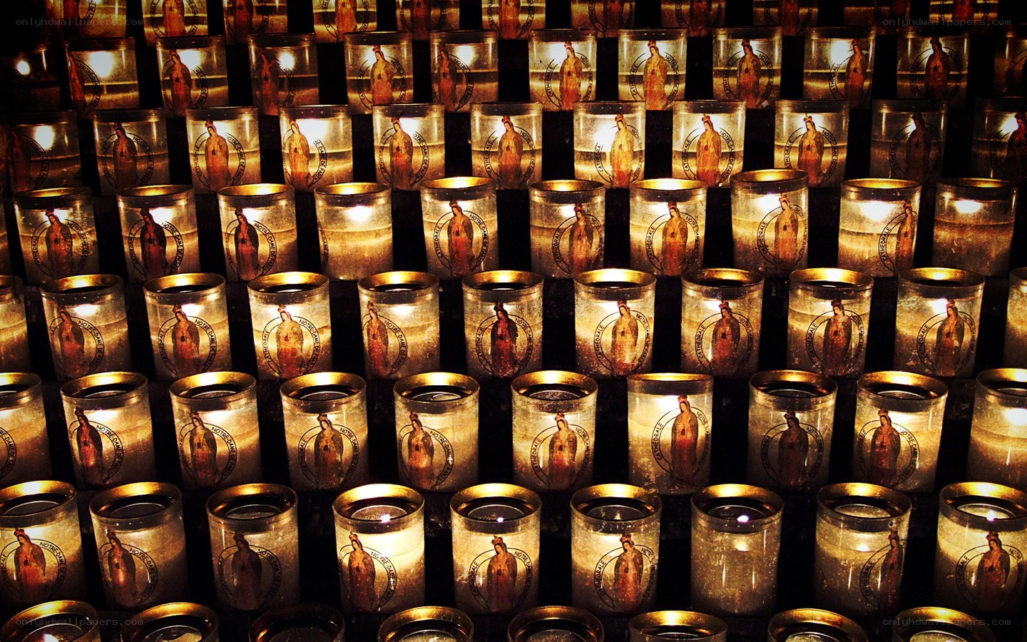 Rows of prayer candles