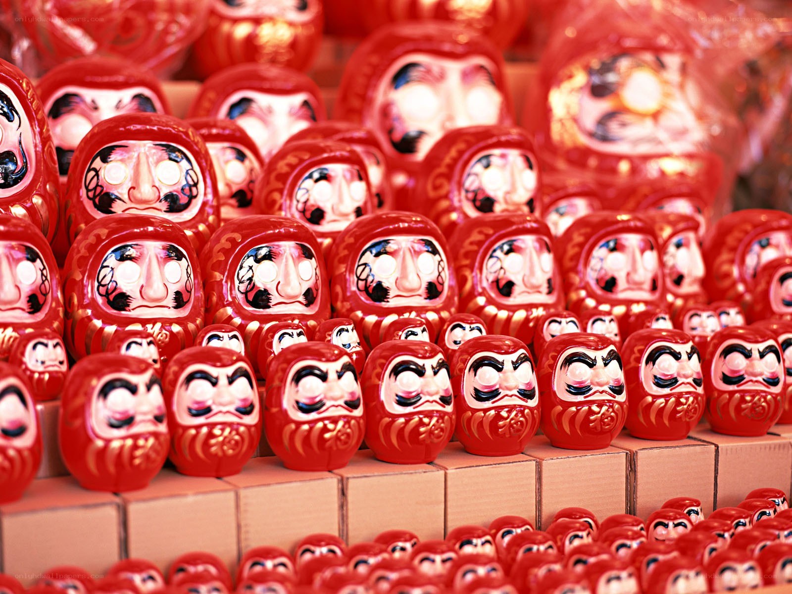 Rows of red daruma dolls