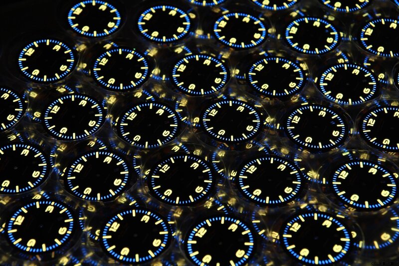 Rows of watch dials in packaging