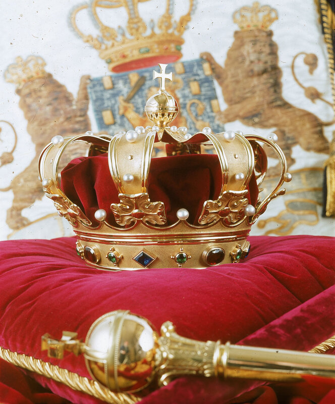 Royal crown and scepter on velvet