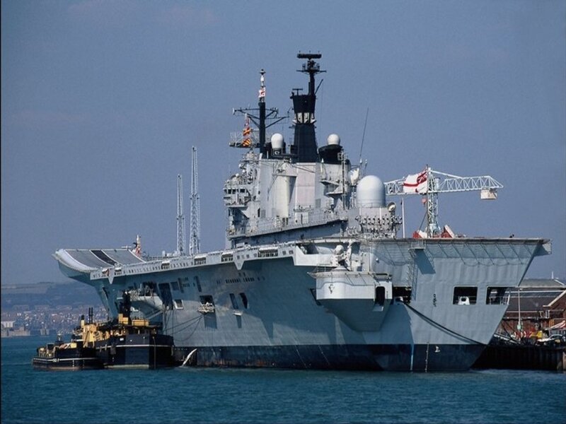 Royal Navy aircraft carrier at port
