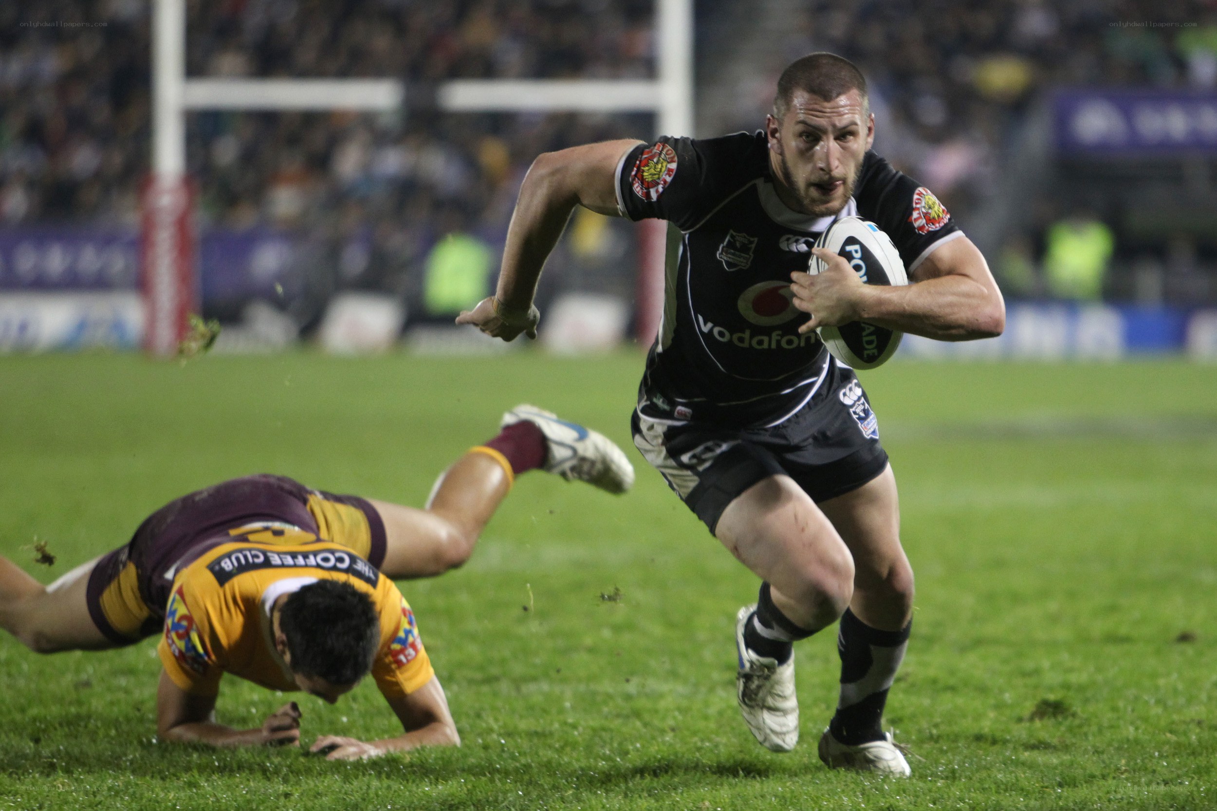 Rugby player running with ball